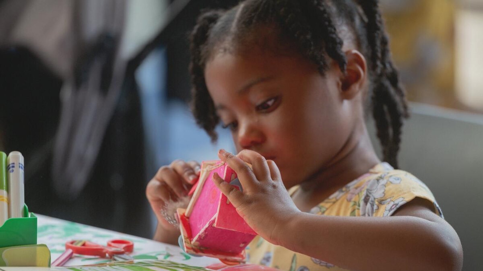 A girl builds a miniature