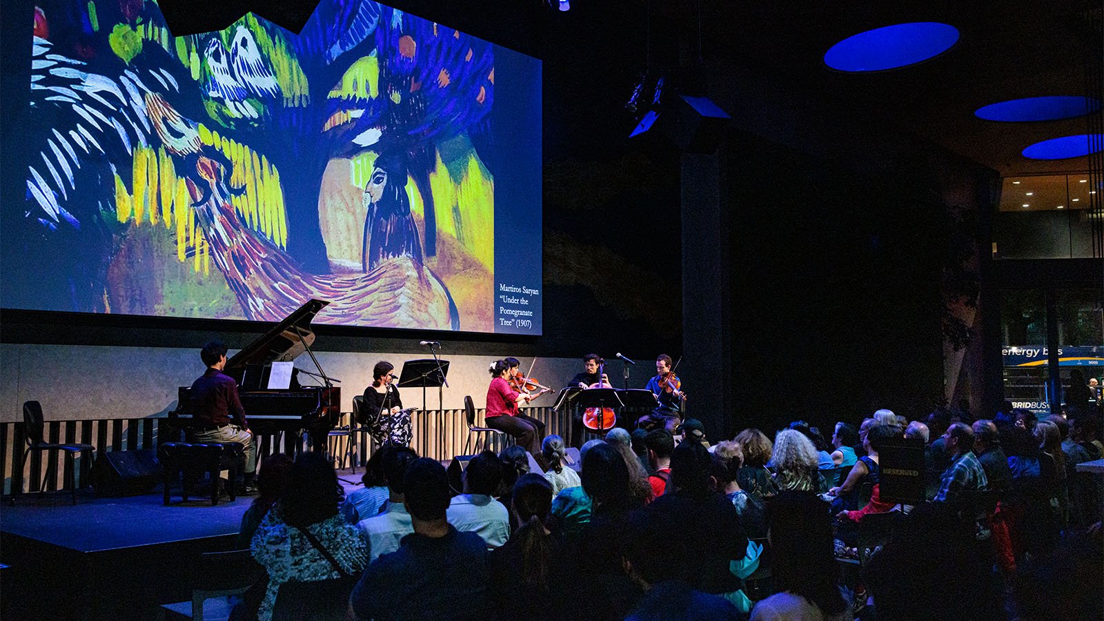 musicians playing on stage for an audience