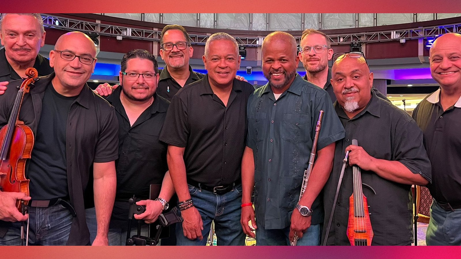 three acrobats doing one handed freezes