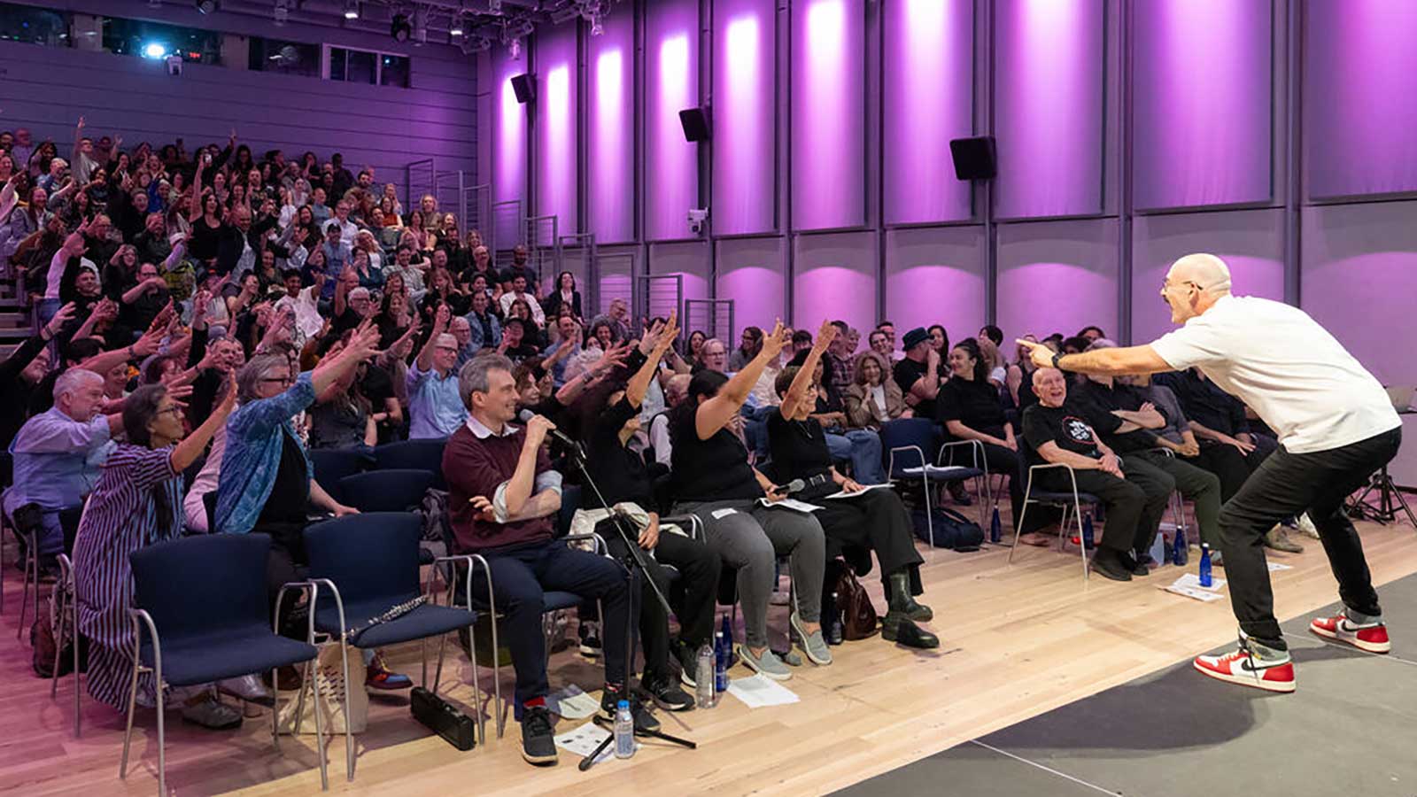 a man performing in front of an audience