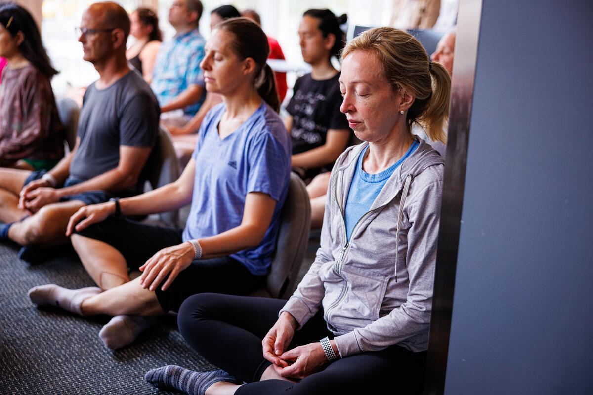 a group meditating side by side