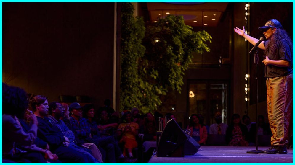 Audience watching a performance at the Atrium