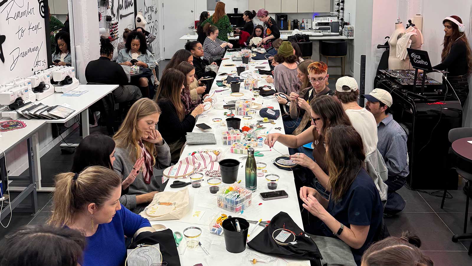 a group of people busy at a table with crafts
