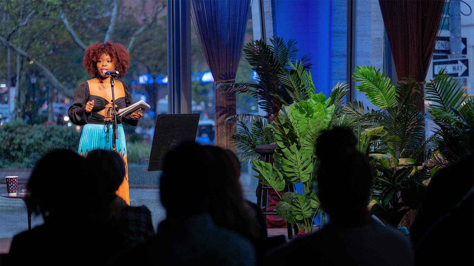 A poet performs on stage