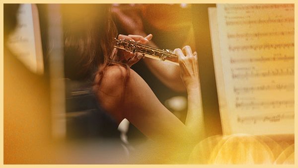 A musician plays the flute