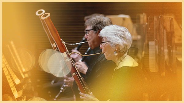 Two musicians play bassoons