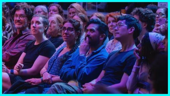 Audience members watching a show at the atrium