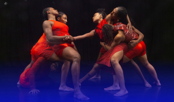 Female dancers in motion with bodies interlocked