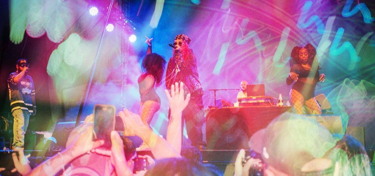 A colorful Kodak photograph of a band performing on stage