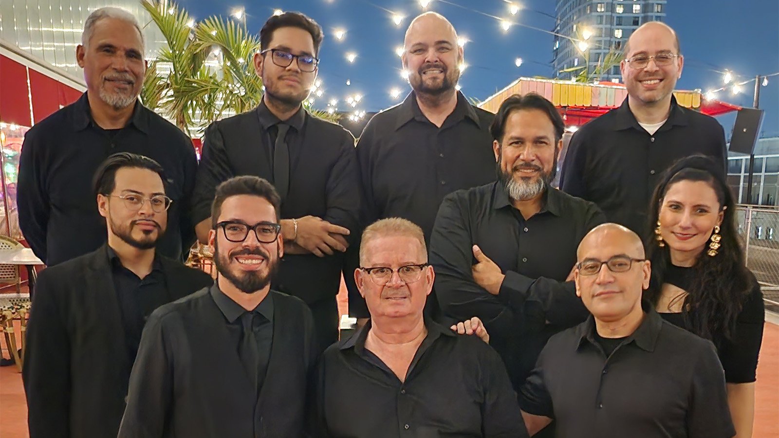 La Charanga Pachá poses in all black outfits