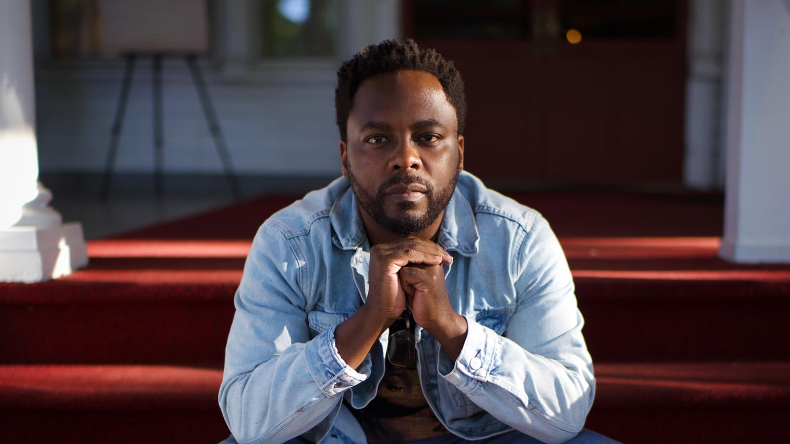 Will Liverman poses on a stoop