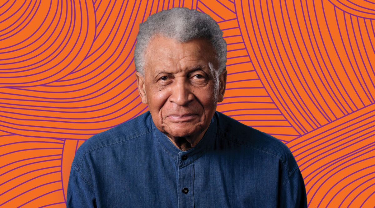 A photo of Abdullah Ibrahim against an orange background