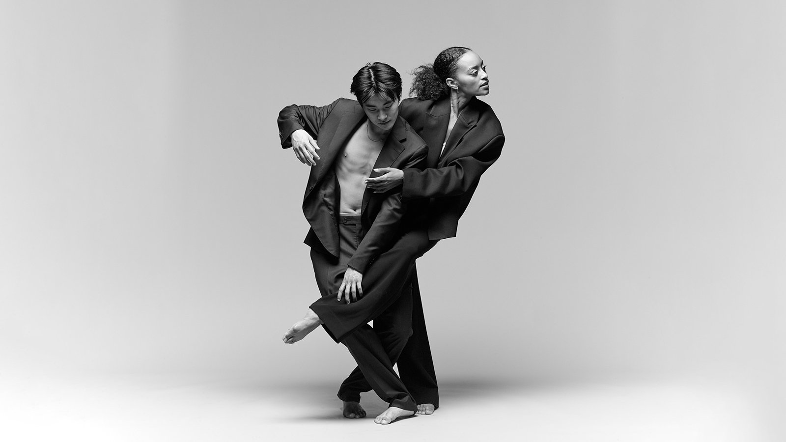 A panel of drag artists talk on stage