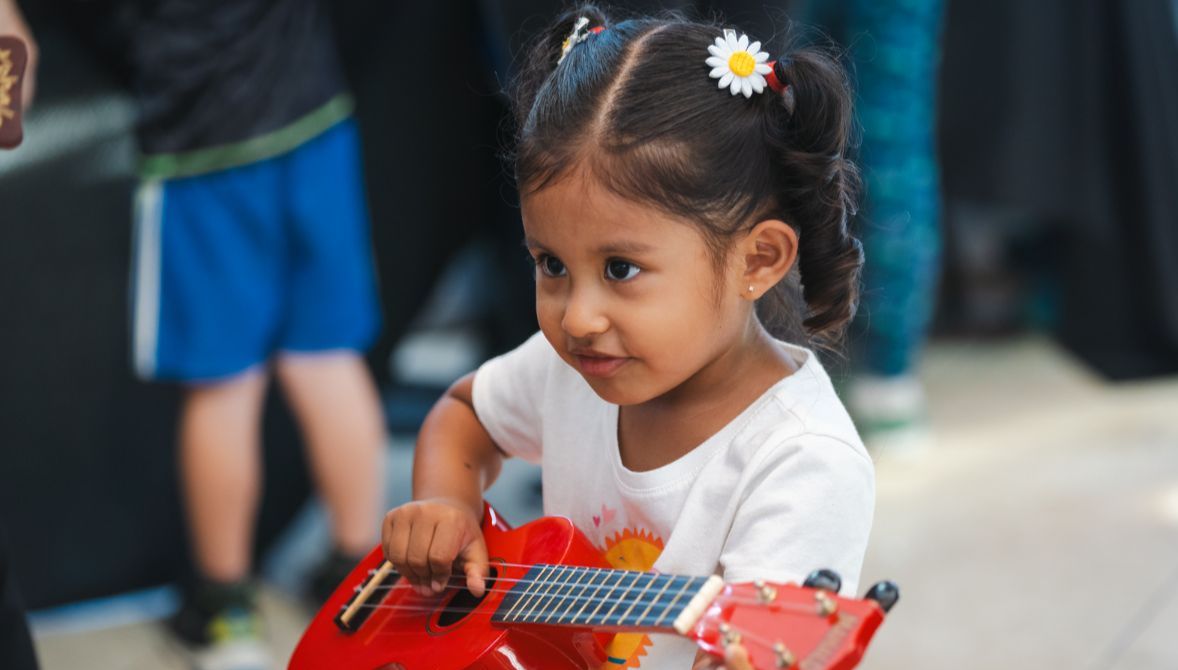 Three men look out into the audience