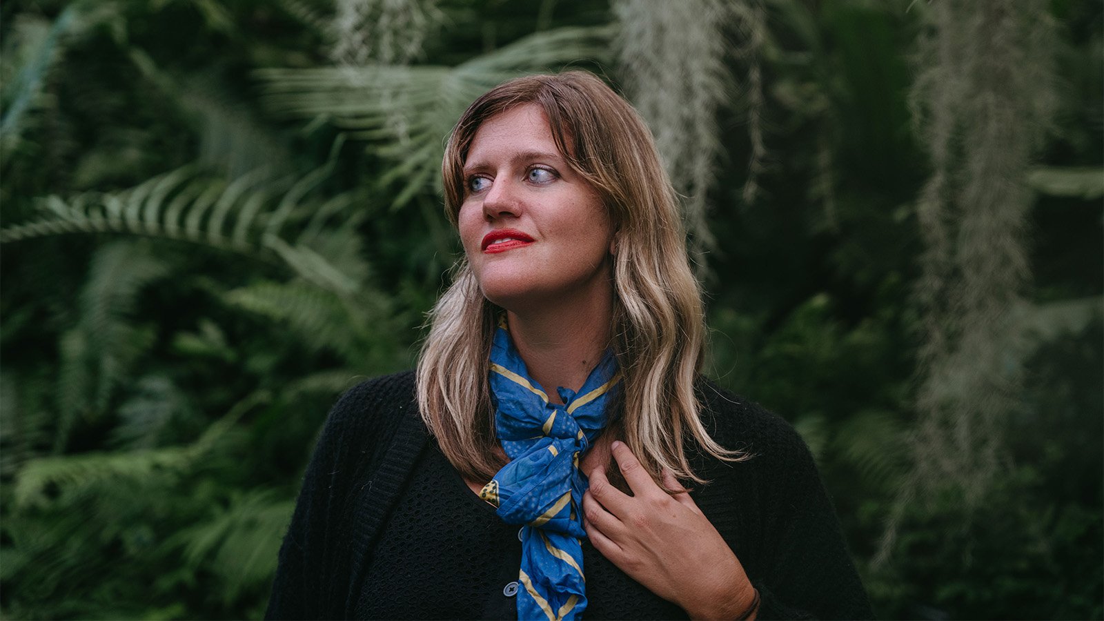 A black and grey tiled background with two cartoon avatars, bubble tea, and a rainbow flag