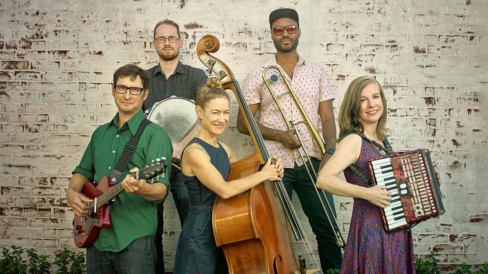 A black and grey tiled background with two cartoon avatars, bubble tea, and a rainbow flag