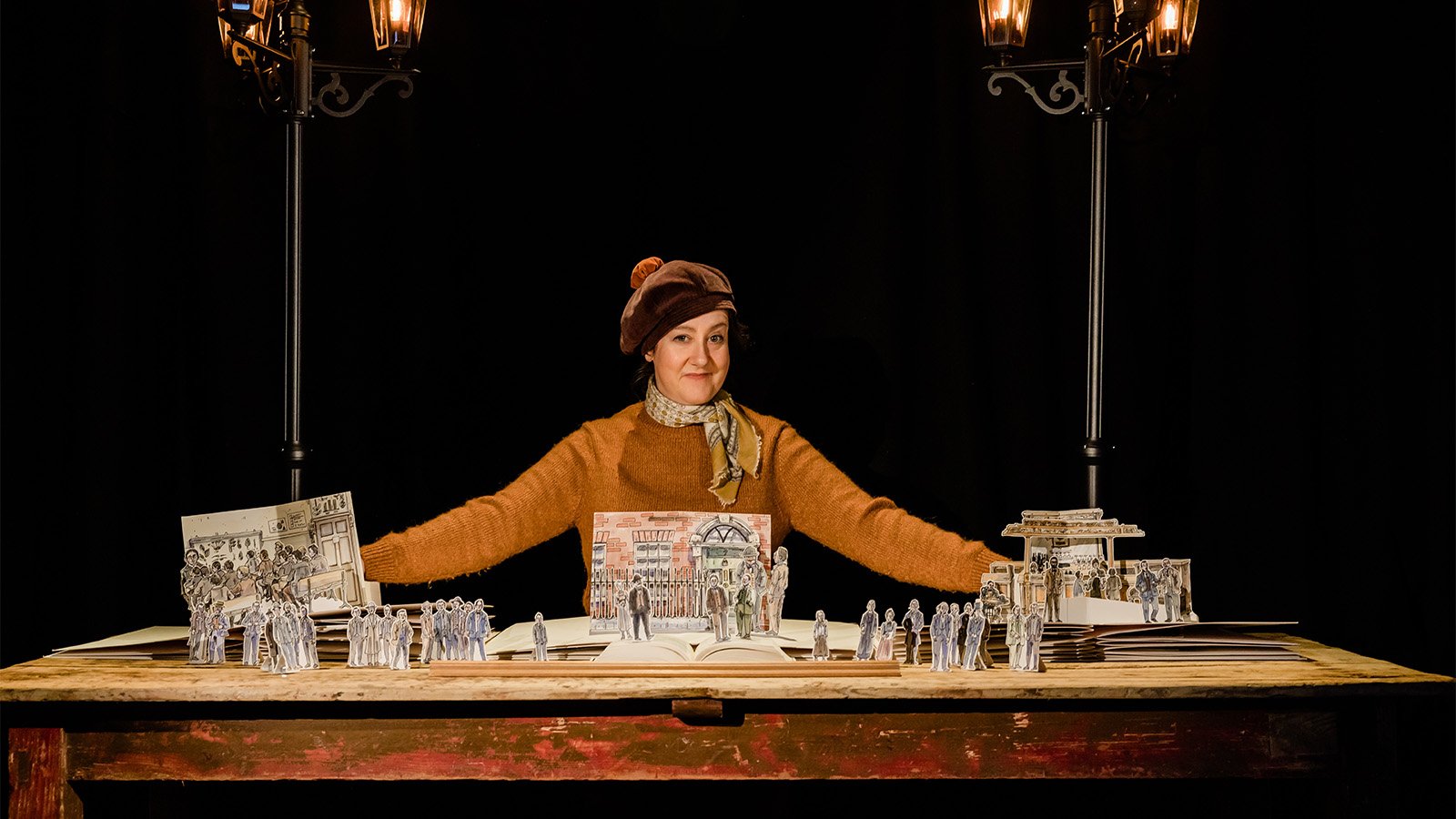 A black and grey tiled background with two cartoon avatars, bubble tea, and a rainbow flag