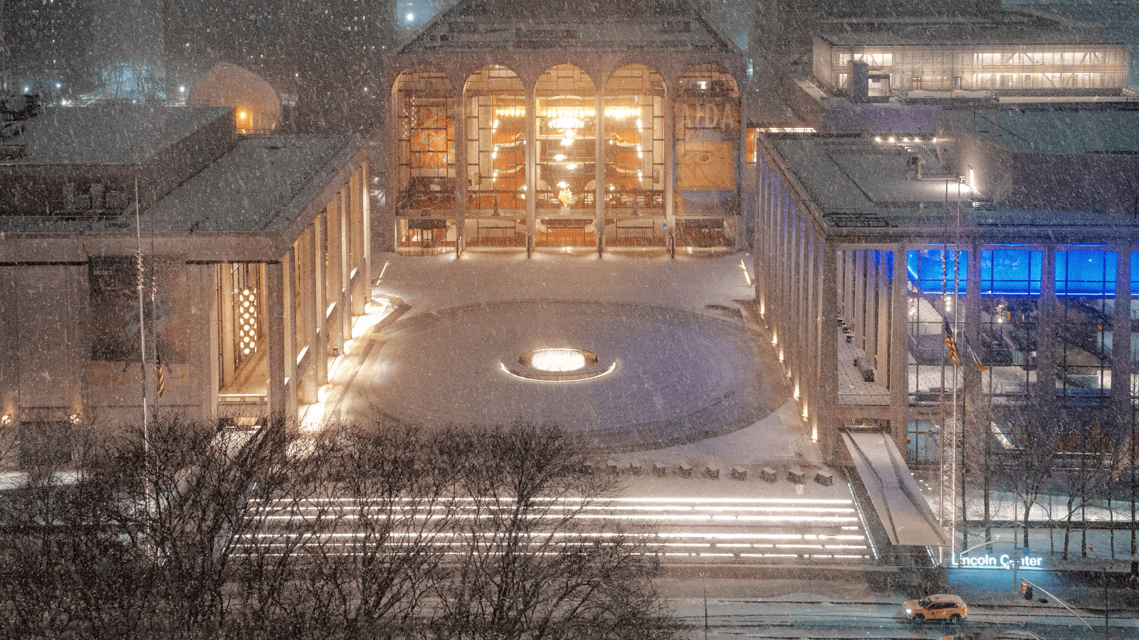 An aerial shot of Lincoln Center's plaza, on a snowy night