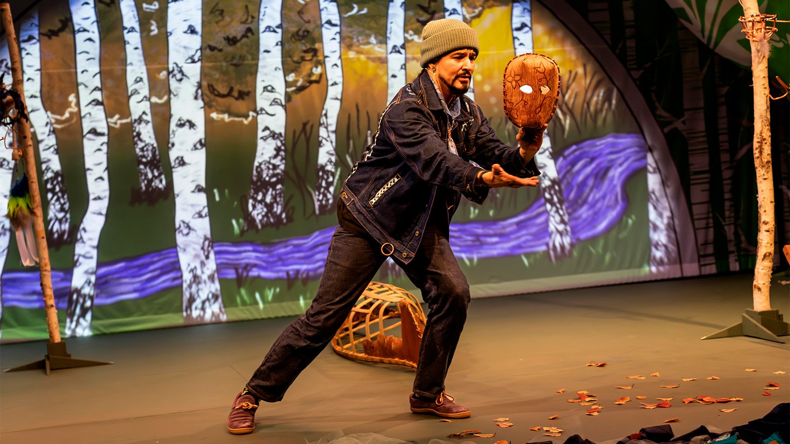 Ty Defore performs with puppets on stage