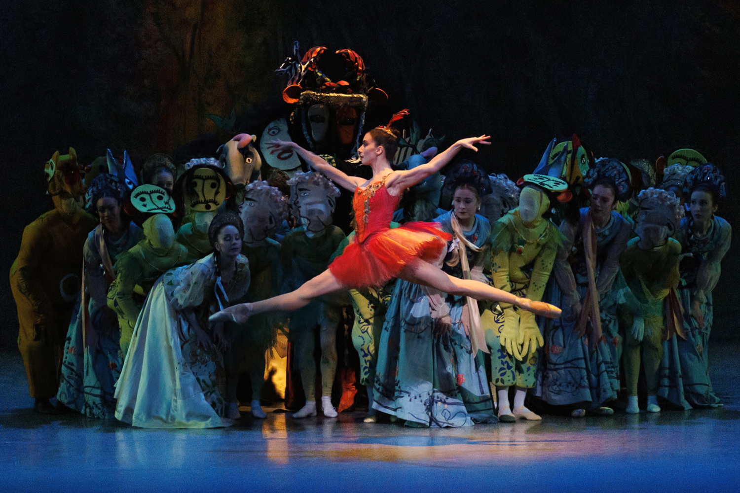Ballet dancers in white outfits on stage