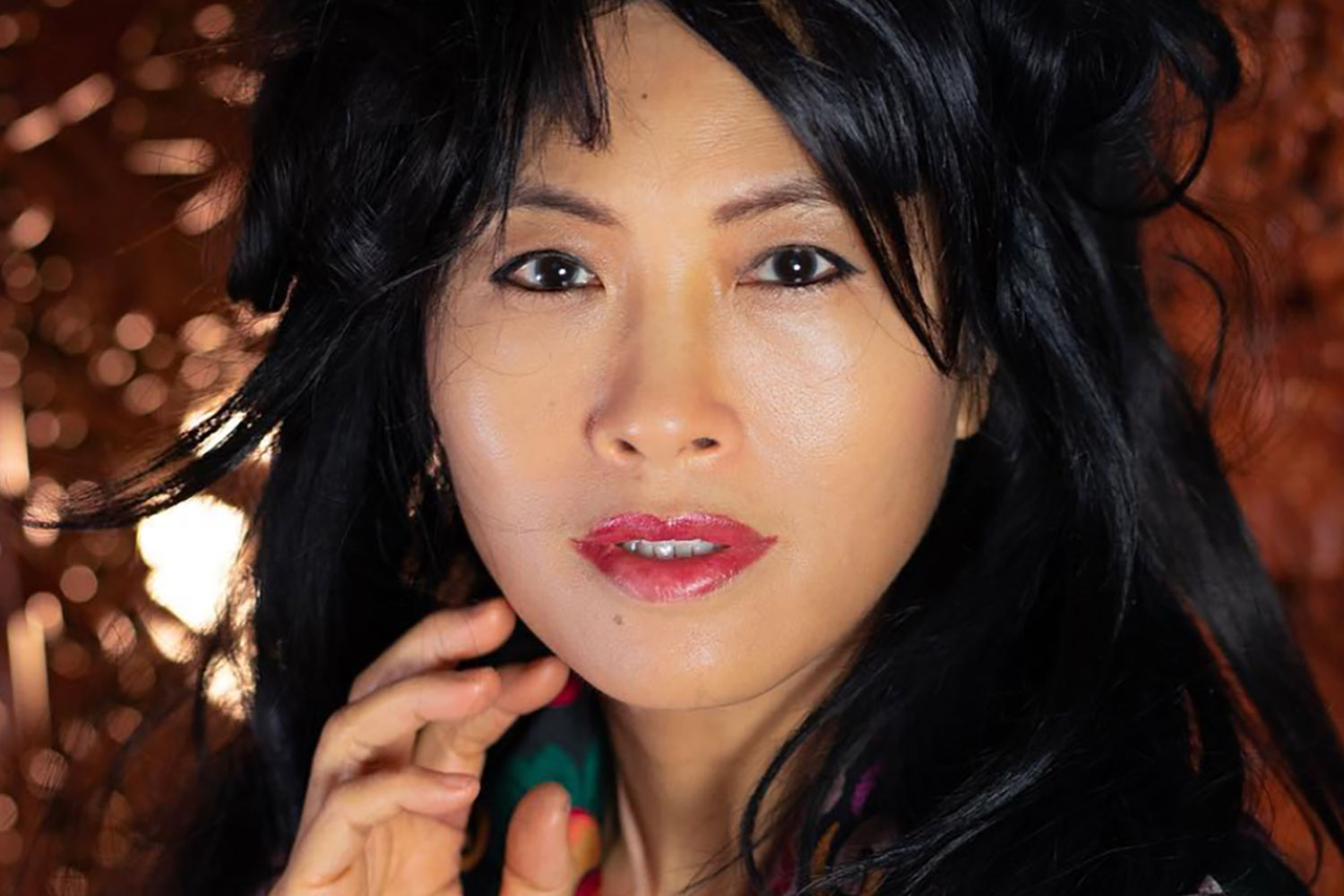 Close up of a Chinese woman with feathered black hair