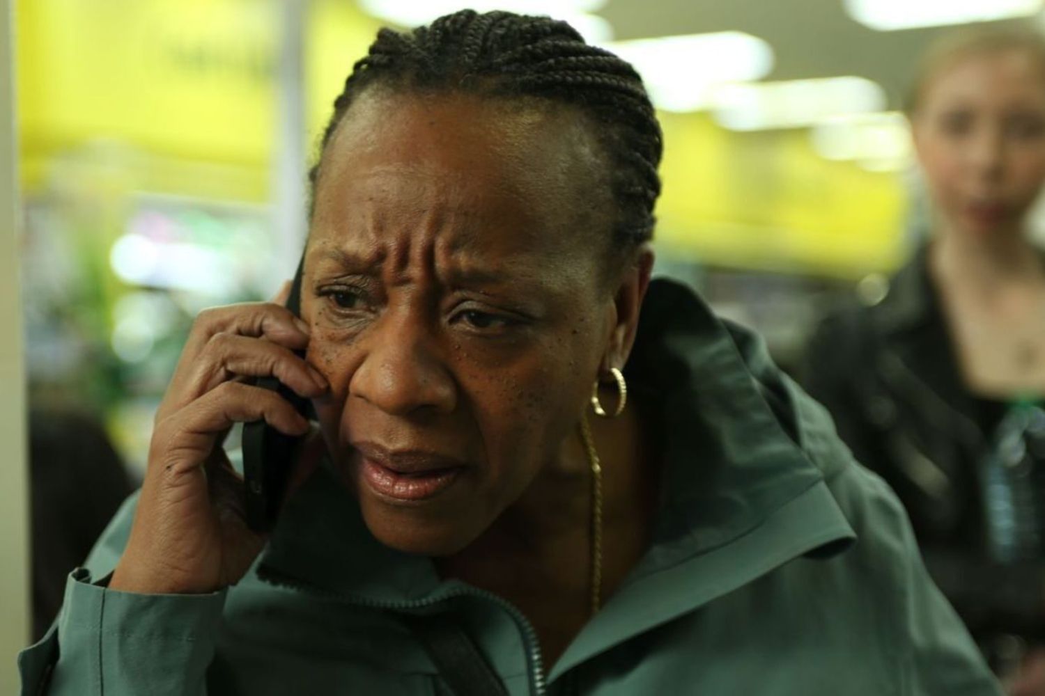 A black woman speaking on a cellphone