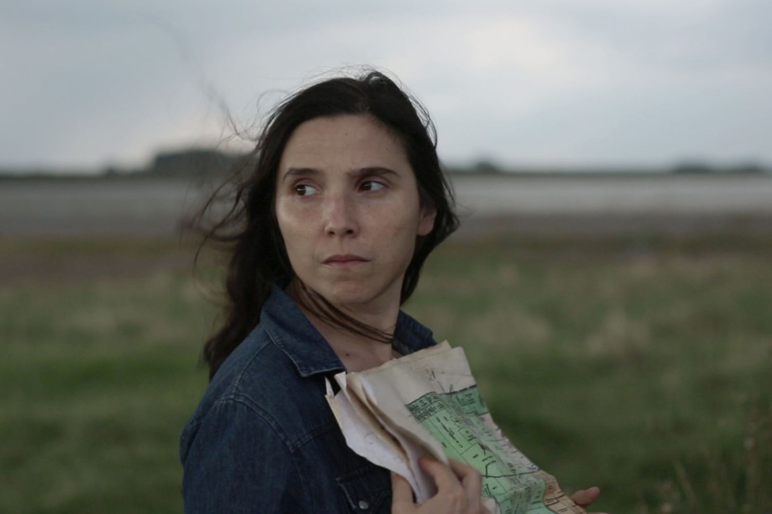 Ballet dancers in white outfits on stage
