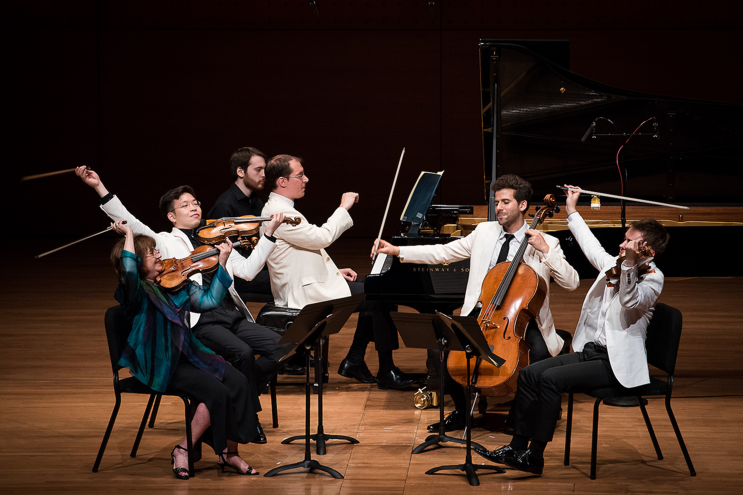 5 musicians playing on stage
