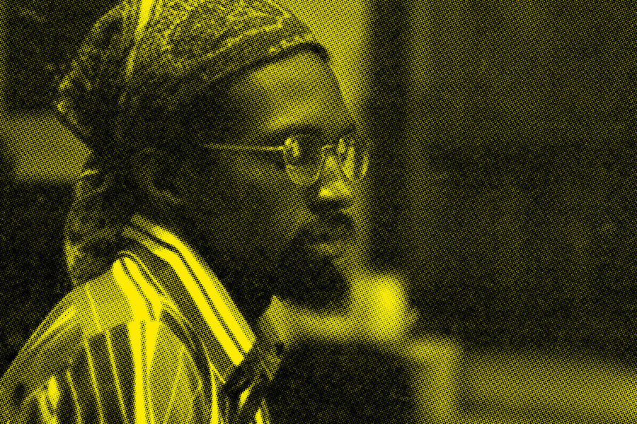 A man wearing glasses and a bandana 
