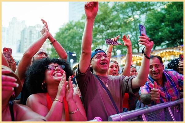 Crowds cheer and clap outside