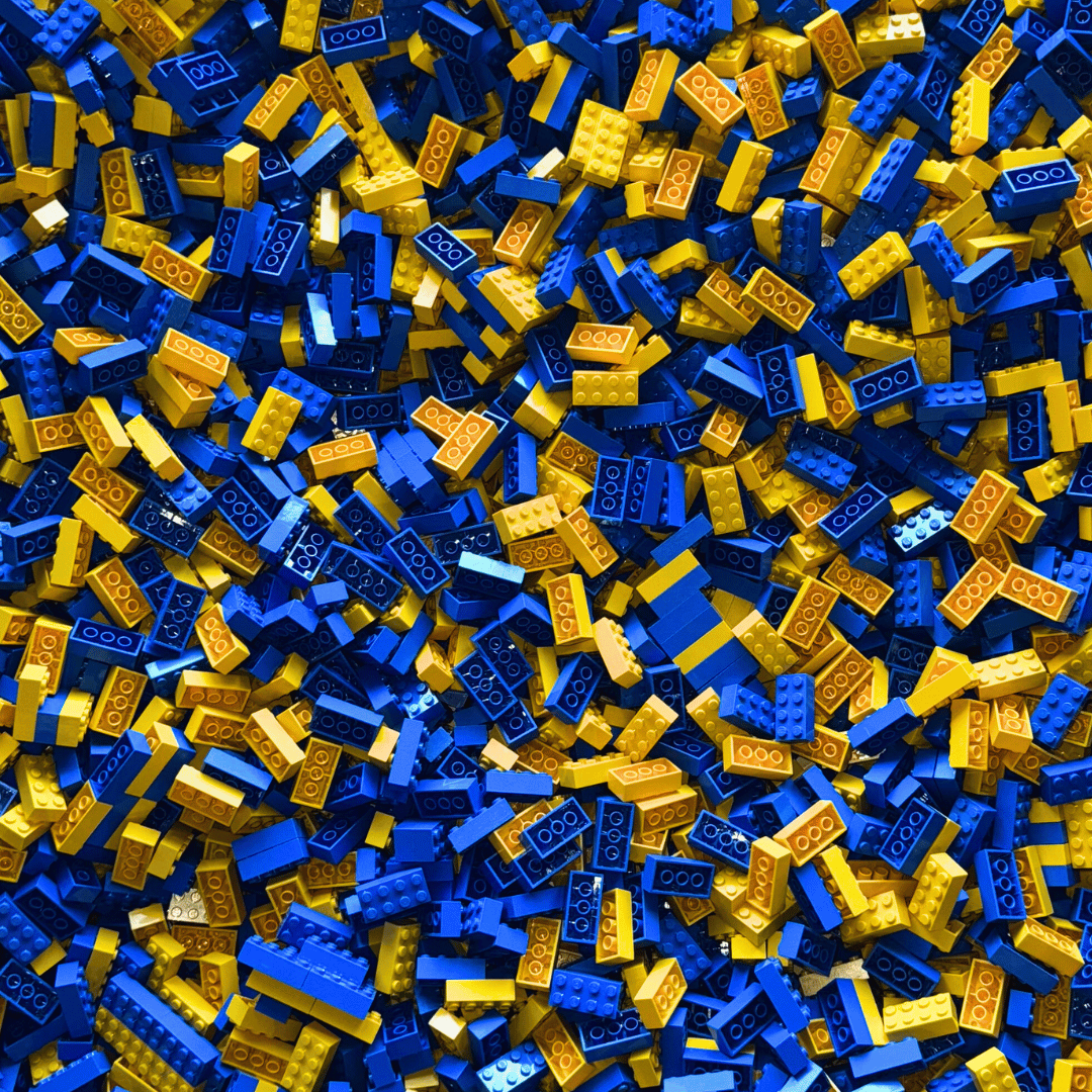 An array of blue and yellow Lego bricks