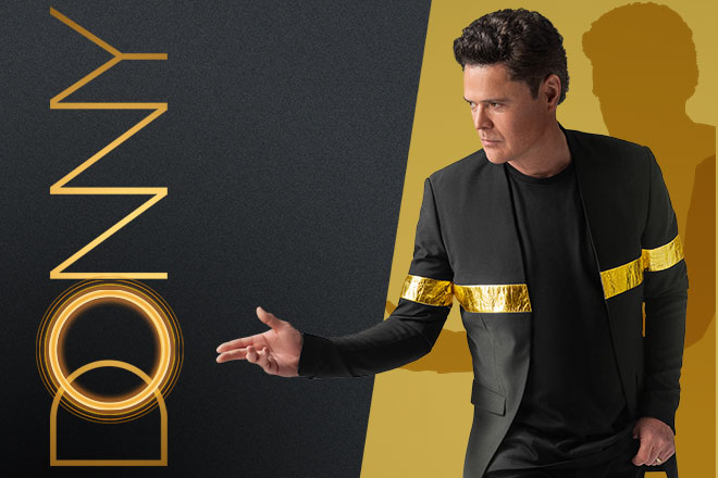 Donny Osmond In Black Jacket With Gold Band
