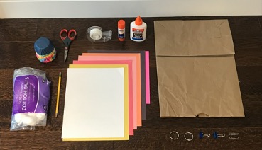 Craft supplies laid out on a table.