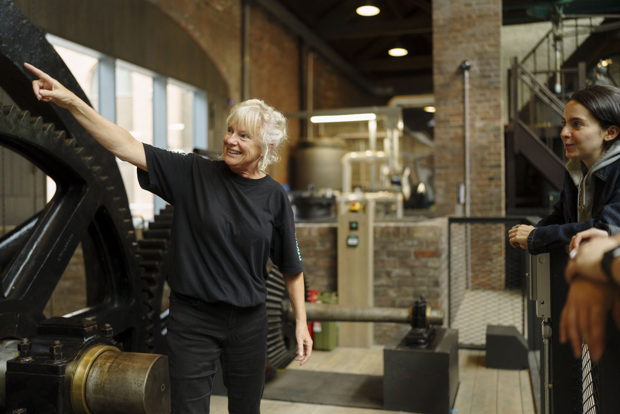 Museum Explainer delivering a talk about a historic engine