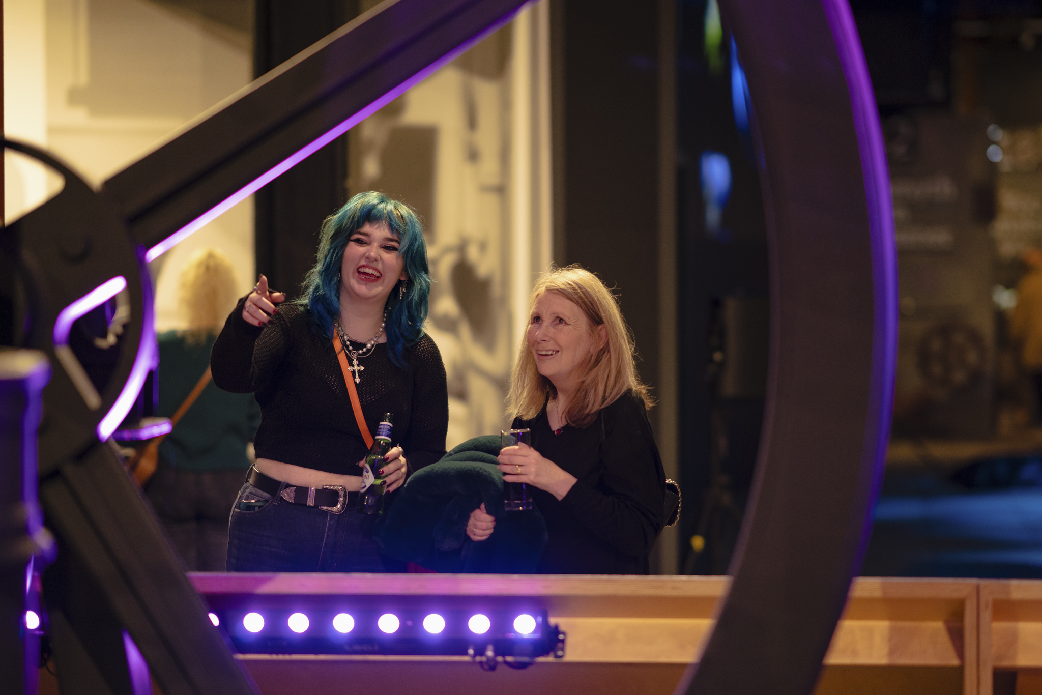 Adults looking at Revolution Manchester display