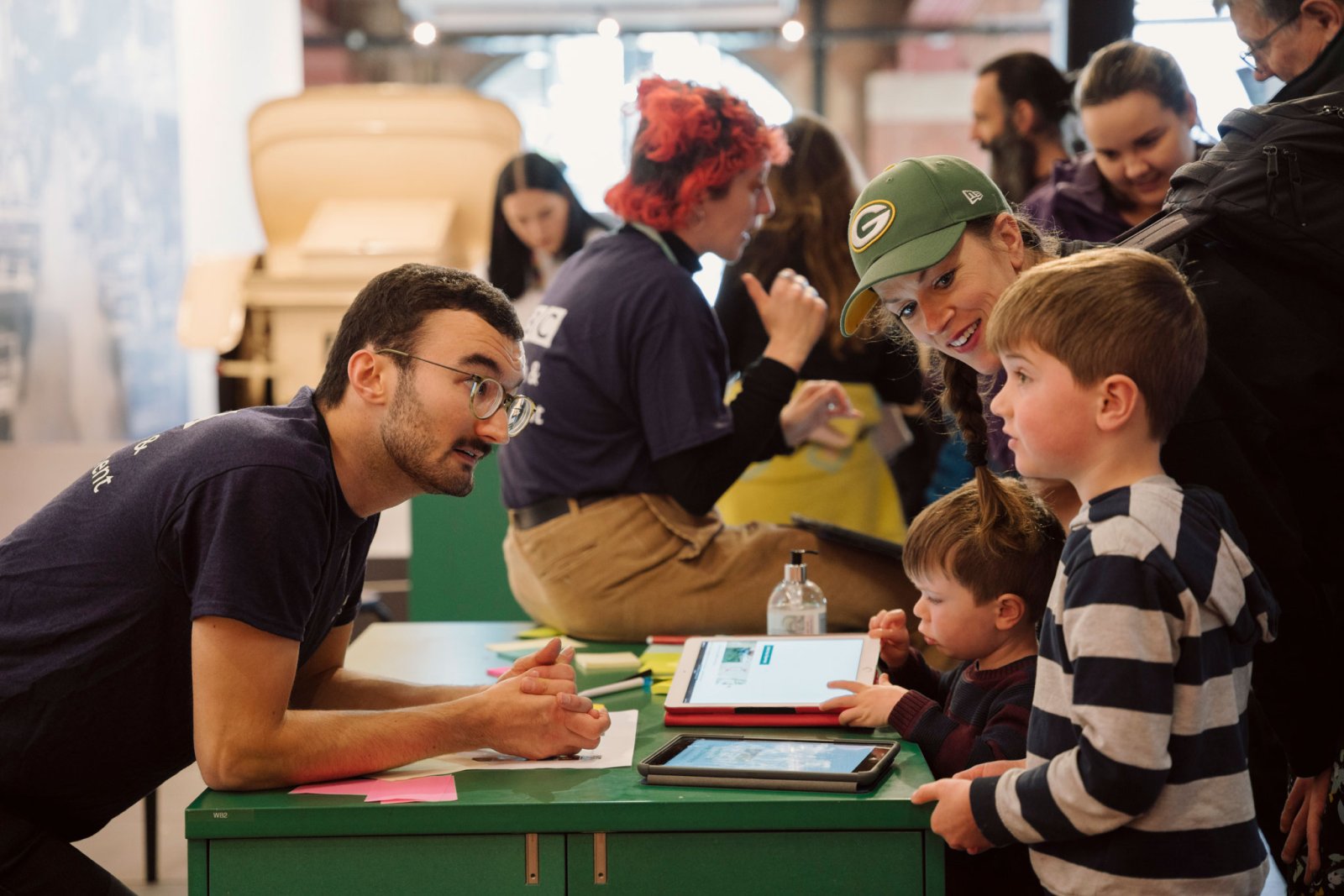 Family talking to a scientist
