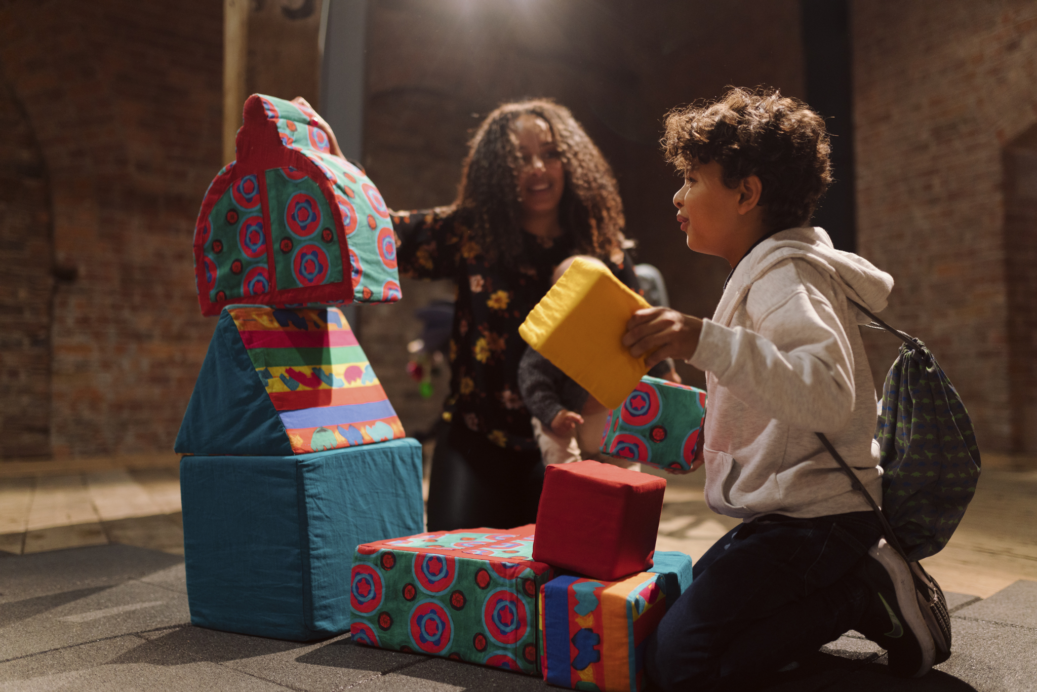 Image of a mother and son in Textile City