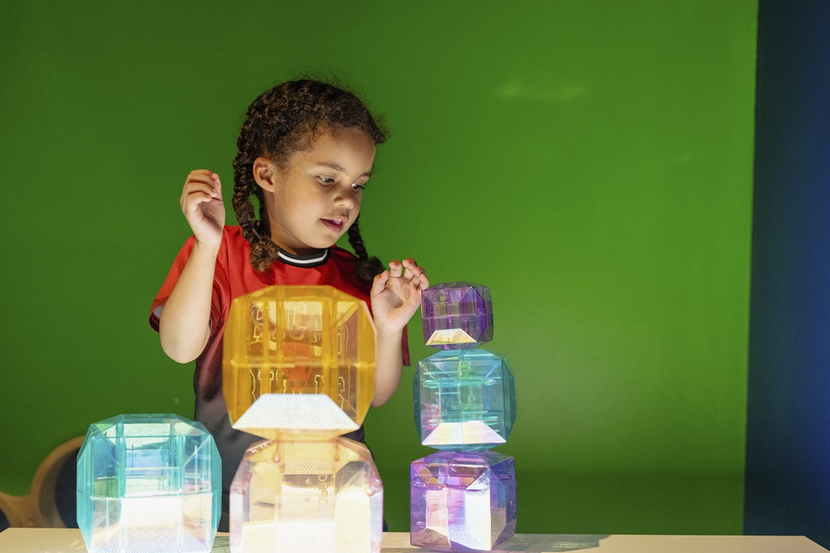 Image of a child with light up building blocks