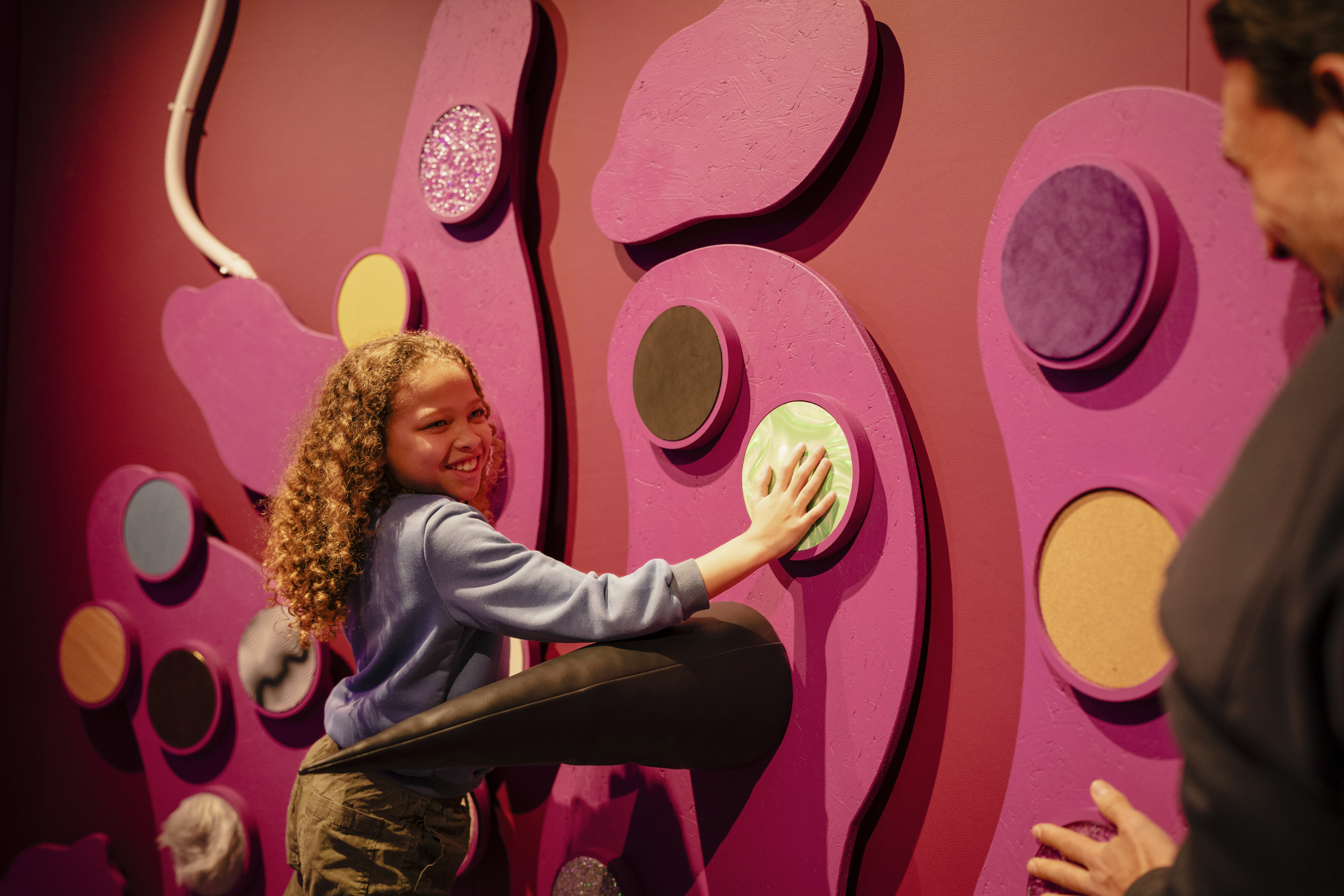 Image of a boy at the texture wall in Operation Ouch! Brains, Bogies and You