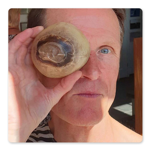 Philip Hoare looking through the eye of a whale. Photo Jeroen Hoekendijk