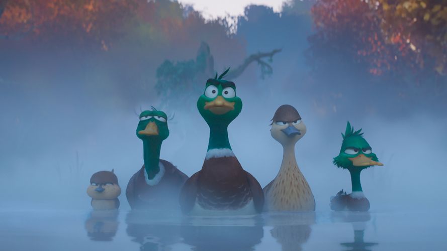 A group of animated ducks swim through a misty river