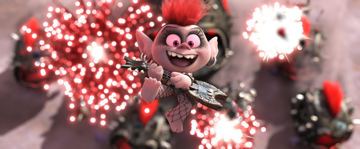 A troll holding a guitar jumps through the air with fireworks behind them
