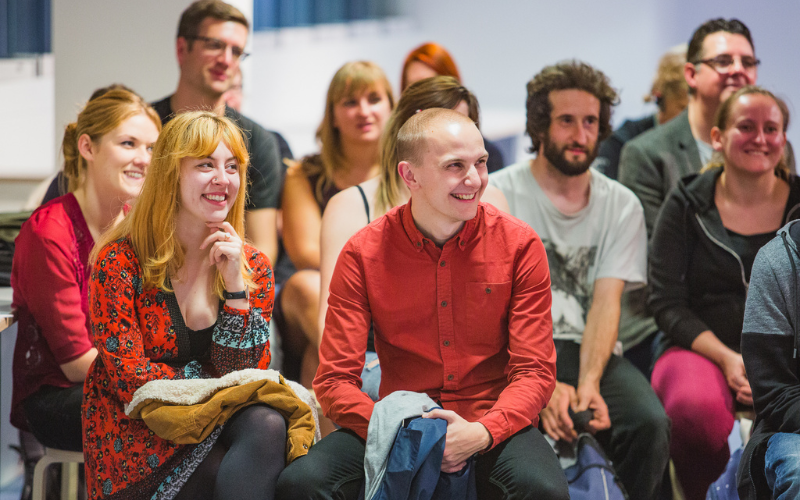 A group of people attending a talk