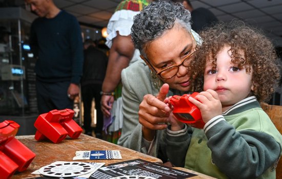 A family doing an activity involving optical toys