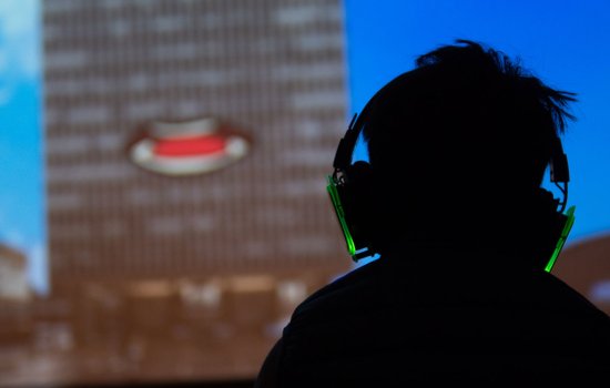 A silhouette of a child in headphones