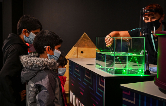 A child looking at a demonstration in Wonderlab