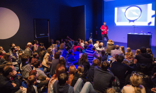 A group of people attending a show in Wonderlab Studio
