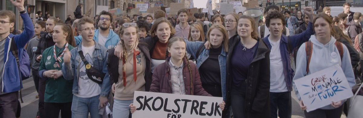 Still from I Am Greta with Greta Thunberg leading a student protest