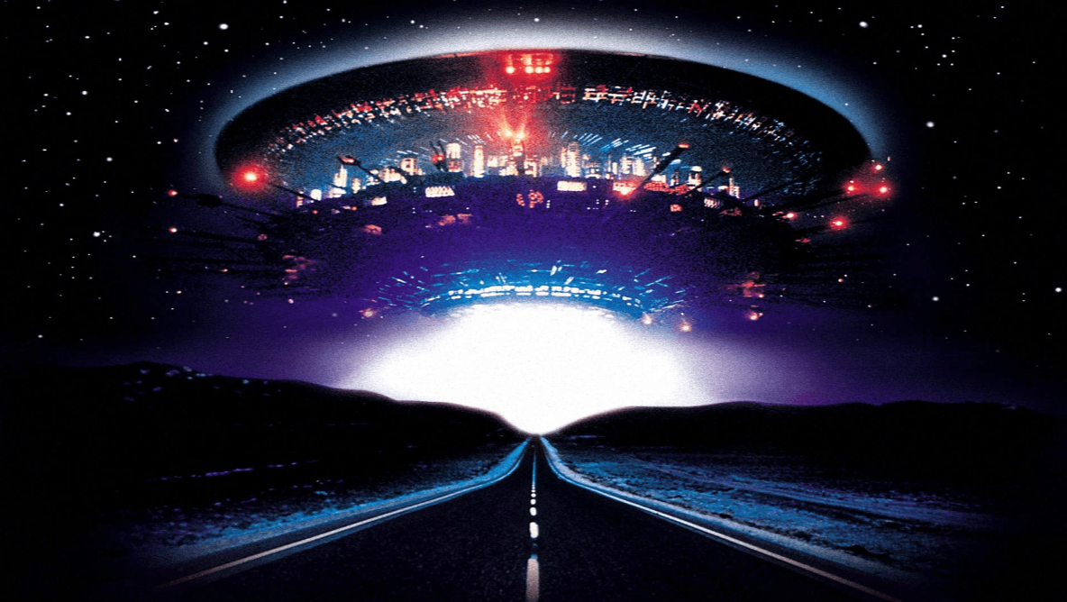 A promo image from Close Encounters showing a brightly lit UFO hovers over a road at night, with a glowing white light beneath it and a starry sky above.