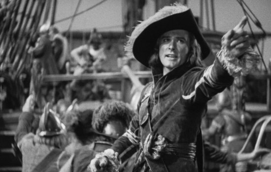 A still from Captain Blood of Errol Flynn dressed in a pirate outfit.